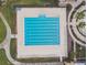 Aerial view of a large swimming pool with multiple lanes and lounge chairs around the deck area at 21837 Briske Morning Ave, Land O Lakes, FL 34637