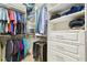 Organized walk-in closet with shelving, hanging rods, and drawers for ample storage space at 21837 Briske Morning Ave, Land O Lakes, FL 34637