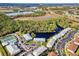 Enjoy this community's aerial view with lakes, lush greenery, tennis courts, and a refreshing community pool at 25050 Sandhill Blvd # 8B1, Punta Gorda, FL 33983