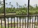 Enjoy the serene waterfront view from the screened-in patio, ideal for relaxation and privacy at 25050 Sandhill Blvd # 8B1, Punta Gorda, FL 33983