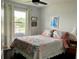Cozy bedroom features a comfortable bed, side tables, and ample natural light at 25050 Sandhill Blvd # 8B1, Punta Gorda, FL 33983