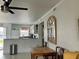 Open floor plan shows the dining area looking into the kitchen with breakfast bar at 25050 Sandhill Blvd # 8B1, Punta Gorda, FL 33983