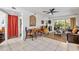 Spacious living area with tile flooring, comfortable seating, and a balcony view at 25050 Sandhill Blvd # 8B1, Punta Gorda, FL 33983