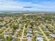 An aerial view shows the neighborhood, house and its proximity to St Pete Beach at 2581 61St S Ave, St Petersburg, FL 33712