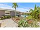 Landscaped backyard offers raised garden beds, a new fence, and privacy at 2581 61St S Ave, St Petersburg, FL 33712