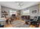 Cozy bedroom featuring a wood floor, desk, bookshelf, and comfortable sitting area at 2581 61St S Ave, St Petersburg, FL 33712