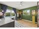 Green bedroom offering natural light and pool view at 2581 61St S Ave, St Petersburg, FL 33712