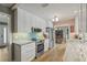 Modern kitchen boasts white cabinets, marble countertops, and stainless steel appliances at 2581 61St S Ave, St Petersburg, FL 33712