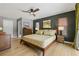 Well-lit main bedroom featuring warm tones and hardwood floors at 2581 61St S Ave, St Petersburg, FL 33712
