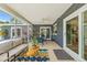 Screened-in patio with comfortable seating, ceiling fan, and a view of the yard at 2581 61St S Ave, St Petersburg, FL 33712