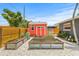 Backyard features a new red shed and raised garden beds with stone ground cover at 2581 61St S Ave, St Petersburg, FL 33712
