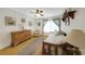 Bedroom area with hardwood floors, a daybed, and a dresser at 3035 Countryside Blvd # 16B, Clearwater, FL 33761