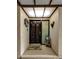 Charming entryway with a decorative door, perfect for welcoming guests to your new home at 3035 Countryside Blvd # 16B, Clearwater, FL 33761