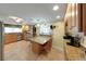 Open kitchen with breakfast table, stainless steel appliances, and abundant countertop space at 3035 Countryside Blvd # 16B, Clearwater, FL 33761