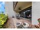 Relax on this cozy patio with a ceiling fan and sliding glass doors for seamless indoor-outdoor living at 3035 Countryside Blvd # 16B, Clearwater, FL 33761