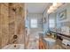 Well-lit bathroom with wooden countertop, bath tub, and attractive decor at 3173 Fountainhead Dr, Largo, FL 33770