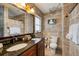 Full bathroom featuring granite countertop, double sinks, tiled walls, and decorative accents at 3173 Fountainhead Dr, Largo, FL 33770