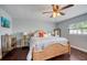 Comfortable bedroom with wood frame bed and nightstands, ceiling fan, and plenty of light at 3173 Fountainhead Dr, Largo, FL 33770