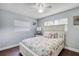 Charming bedroom with beach themed comforter, white furniture and plenty of natural light at 3173 Fountainhead Dr, Largo, FL 33770