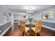 Formal dining room with a large table, seating for six, and views into other rooms at 3173 Fountainhead Dr, Largo, FL 33770