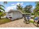 Beautiful home with a brick patio, tropical landscaping, and an enclosed lanai for relaxing outdoors at 3173 Fountainhead Dr, Largo, FL 33770