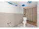 A bathroom area undergoing renovation, featuring new fixtures, wall framework, and a toilet awaiting final installation at 326 Moorings Cove Dr # 2B, Tarpon Springs, FL 34689