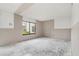 A bedroom under construction features a window overlooking the neighborhood at 326 Moorings Cove Dr # 2B, Tarpon Springs, FL 34689