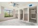A bedroom under construction features a large window and doorways to the closet and bathroom at 326 Moorings Cove Dr # 2B, Tarpon Springs, FL 34689