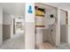 Unfinished hallway leading to the outside, with a closet and drywall ready for finishing at 326 Moorings Cove Dr # 2B, Tarpon Springs, FL 34689