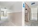 A hallway features new wall framework, visible electrical wiring, and doorways to other rooms at 326 Moorings Cove Dr # 2B, Tarpon Springs, FL 34689
