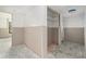 Unfinished living room featuring new drywall and a closet with shelving, ready for customization at 326 Moorings Cove Dr # 2B, Tarpon Springs, FL 34689
