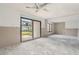 Spacious living room featuring glass doors leading to marina at 326 Moorings Cove Dr # 2B, Tarpon Springs, FL 34689