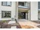 Back patio with canal view, showing an AC unit and convenient access to the home at 326 Moorings Cove Dr # 2B, Tarpon Springs, FL 34689