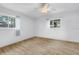 Sunlit bedroom with wood floors, bright natural light, and a ceiling fan at 3652 18Th N Ave, St Petersburg, FL 33713