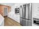 Open kitchen with stainless steel appliances and white cabinets at 3652 18Th N Ave, St Petersburg, FL 33713