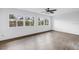 Bright living room featuring wood floors and large windows providing ample natural light at 3652 18Th N Ave, St Petersburg, FL 33713