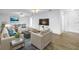 Virtually staged living area with modern furniture, a TV, and a view of the dining space at 3652 18Th N Ave, St Petersburg, FL 33713