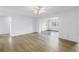 Well-lit room with light wood flooring and views into other rooms with natural light at 3652 18Th N Ave, St Petersburg, FL 33713