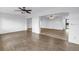 An expansive living area with light wood flooring offers abundant space and views of other rooms at 3652 18Th N Ave, St Petersburg, FL 33713