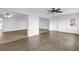 Bright living room showcasing wood floors and an open-concept layout with modern ceiling fans at 3652 18Th N Ave, St Petersburg, FL 33713
