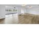 Open floor plan showcasing light wood flooring with a view of the connecting rooms and natural light at 3652 18Th N Ave, St Petersburg, FL 33713