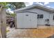 A backyard shed with a patio, providing additional storage and workspace on the property at 3652 18Th N Ave, St Petersburg, FL 33713