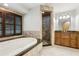 Bright bathroom showcasing a large soaking tub, tiled shower, and granite countertop vanity at 3753 Thornbush Ln, New Port Richey, FL 34655