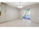 Inviting dining space featuring sliding glass doors, ceramic tile flooring, and ample natural light at 3753 Thornbush Ln, New Port Richey, FL 34655