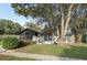 Charming single-Gathering home featuring a beautiful stone accent and mature tree in the front yard at 3753 Thornbush Ln, New Port Richey, FL 34655