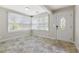 Cozy sunroom with tile flooring and large windows offering plenty of natural light at 3753 Thornbush Ln, New Port Richey, FL 34655