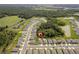 Overhead view of neighborhood surrounded by natural beauty, including ponds, lakes and green spaces at 39024 Harlow Rose Dr, Zephyrhills, FL 33540