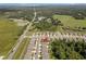 Expansive aerial view displaying the neighborhood's position near lakes, trees, and major roadways at 39024 Harlow Rose Dr, Zephyrhills, FL 33540
