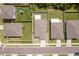 Birds eye view of house with fenced yard, landscaping and private driveway on a quiet street at 39024 Harlow Rose Dr, Zephyrhills, FL 33540