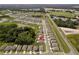Street-level aerial view showing home's location within a well-planned community near lush surroundings at 39024 Harlow Rose Dr, Zephyrhills, FL 33540